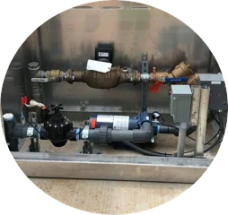 A water heater featuring visible valves and pipes, showcasing its plumbing connections and operational components.